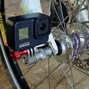 Wheel hub side action camera bracket for most bicycles